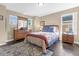 Spacious bedroom with dresser, nightstands, and a comfortable bed at 476 Calabay Parc Blvd, Davenport, FL 33897