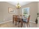 Formal dining room with a wood table and chandelier at 476 Calabay Parc Blvd, Davenport, FL 33897