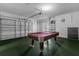 Spacious garage with a pool table and extra storage at 476 Calabay Parc Blvd, Davenport, FL 33897