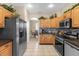 Modern kitchen with stainless steel appliances and dark countertops at 476 Calabay Parc Blvd, Davenport, FL 33897
