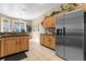 Kitchen with stainless steel refrigerator and wood cabinets at 476 Calabay Parc Blvd, Davenport, FL 33897
