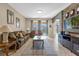 Living room with a wood feature wall and access to backyard at 476 Calabay Parc Blvd, Davenport, FL 33897