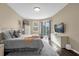 Spacious bedroom with pool view and large TV at 476 Calabay Parc Blvd, Davenport, FL 33897