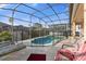 Screened pool and patio with lounge chairs at 476 Calabay Parc Blvd, Davenport, FL 33897
