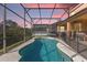 Inviting kidney-shaped pool with screened enclosure at 476 Calabay Parc Blvd, Davenport, FL 33897