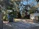 View of backyard with trees and small shed at 6790 Bass Hwy, St Cloud, FL 34771