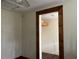 Small bedroom with wood-framed entryway and carpet flooring at 6790 Bass Hwy, St Cloud, FL 34771
