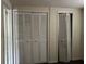 Bedroom with double door closets offering ample storage at 6790 Bass Hwy, Saint Cloud, FL 34771