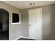 Interior entryway with grey walls, white door and wood-look flooring at 6790 Bass Hwy, St Cloud, FL 34771
