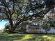Ranch style home with mature oak tree and fenced yard at 6790 Bass Hwy, St Cloud, FL 34771