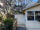 Front view of the house with wooden steps at 6790 Bass Hwy, St Cloud, FL 34771