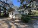 Side view of the house with a wooden deck at 6790 Bass Hwy, St Cloud, FL 34771