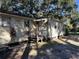 Front view of a charming house with a wooden deck at 6790 Bass Hwy, St Cloud, FL 34771