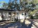 Cozy one-story house with a deck and mature trees at 6790 Bass Hwy, St Cloud, FL 34771