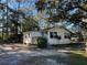 House exterior view, showcasing front yard and driveway at 6790 Bass Hwy, St Cloud, FL 34771