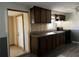 Kitchen with dark wood cabinets and modern appliances at 6790 Bass Hwy, St Cloud, FL 34771