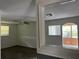 Living room with view into adjacent sunroom at 6790 Bass Hwy, St Cloud, FL 34771