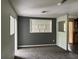 Spacious living room with built-in shelving and a view of the sunroom at 6790 Bass Hwy, St Cloud, FL 34771