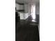 Open living area with dark hardwood floors at 15231 Honeybell Dr, Winter Garden, FL 34787