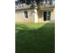 Home's backyard with grassy lawn and patio at 15231 Honeybell Dr, Winter Garden, FL 34787