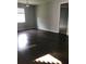 Spacious bedroom with hardwood floors and large window at 15231 Honeybell Dr, Winter Garden, FL 34787