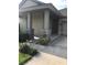 Inviting front porch entry with stone accents at 15231 Honeybell Dr, Winter Garden, FL 34787
