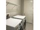 Laundry room with washer, dryer, and overhead shelving at 15231 Honeybell Dr, Winter Garden, FL 34787
