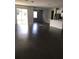 Spacious living area with hardwood floors and access to backyard at 15231 Honeybell Dr, Winter Garden, FL 34787