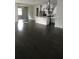 Open concept living and dining area with hardwood floors at 15231 Honeybell Dr, Winter Garden, FL 34787