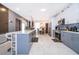 Modern kitchen with gray cabinets, white countertops, and stainless steel appliances at 905 Knollwood Dr, Davenport, FL 33837