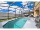 Large screened-in pool with plenty of space for entertaining at 905 Knollwood Dr, Davenport, FL 33837