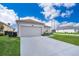 Attached garage with a long driveway at 905 Knollwood Dr, Davenport, FL 33837