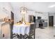 Modern kitchen with stainless steel appliances and breakfast table at 905 Knollwood Dr, Davenport, FL 33837
