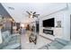 Bright and airy living room with a fireplace and open floor plan at 905 Knollwood Dr, Davenport, FL 33837