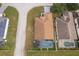 Bird's-eye view of a house with a pool and screened enclosure at 905 Knollwood Dr, Davenport, FL 33837