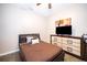 Bedroom with a brown bed, dresser, and a flat-screen TV at 905 Knollwood Dr, Davenport, FL 33837
