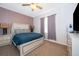 Bedroom with a teal bed, nightstands, and ceiling fan at 905 Knollwood Dr, Davenport, FL 33837