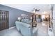 Open living room featuring a spacious layout, light-colored flooring and comfortable seating at 905 Knollwood Dr, Davenport, FL 33837