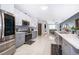 Modern kitchen with stainless steel appliances and gray cabinets at 905 Knollwood Dr, Davenport, FL 33837