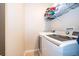 Laundry room with washer, dryer, and shelving for storage at 905 Knollwood Dr, Davenport, FL 33837