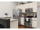 Modern kitchen with stainless steel appliances and granite countertops at 8968 Silver Pl, Kissimmee, FL 34747