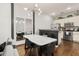 Elegant dining area with marble table and modern chairs, adjacent to kitchen at 8968 Silver Pl, Kissimmee, FL 34747