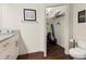 Bathroom with granite countertop, storage closet, and toilet at 8968 Silver Pl, Kissimmee, FL 34747