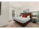 Spacious bedroom with king-size bed, natural light, and accent wall at 8968 Silver Pl, Kissimmee, FL 34747