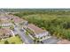 Aerial view of townhouses with parking and green spaces at 8968 Silver Pl, Kissimmee, FL 34747