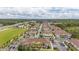 Aerial view of community, showcasing townhouses and nearby amenities at 8968 Silver Pl, Kissimmee, FL 34747