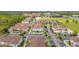 Aerial view of townhouses with pool and parking at 8968 Silver Pl, Kissimmee, FL 34747