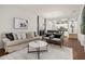 Open living room with modern decor and kitchen view at 8968 Silver Pl, Kissimmee, FL 34747