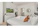 Comfortable bedroom with king-size bed, TV, and access to a bathroom at 8968 Silver Pl, Kissimmee, FL 34747