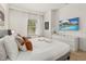 Bright bedroom featuring a king-size bed and calming decor at 8968 Silver Pl, Kissimmee, FL 34747